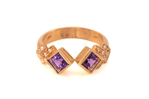 Lot 41 - An amethyst and diamond dress ring, featuring...
