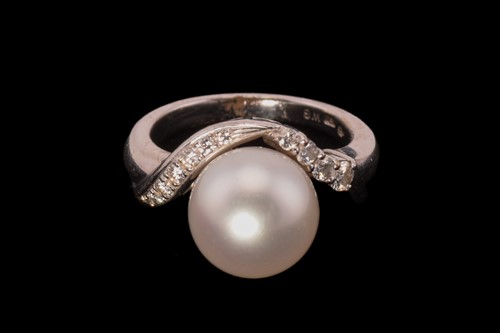 Lot 213 - A Mikimoto pearl and diamond dress ring,...