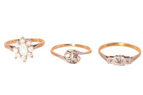 Lot 49 - Two diamond rings and a synthetic opal ring;...