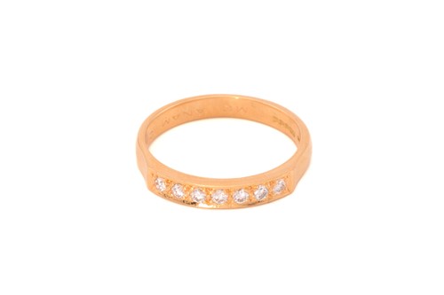 Lot 71 - A diamond half eternity ring in 18ct gold,...
