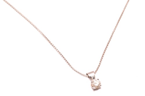Lot 129 - A diamond and 18ct gold pendant on chain,...