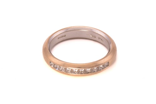 Lot 131 - A half eternity diamond ring in 18ct...