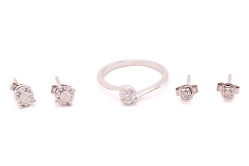 Lot 170 - A diamond solitaire ring in 18ct gold and two...