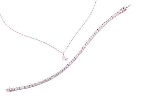 Lot 165 - A 9ct gold zodiac pendant and a 9ct gold CZ...