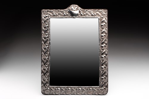 Lot 448 - A silver-framed dressing table mirror of...