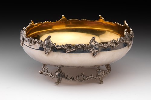 Lot 286 - A round bowl with cast scrolling rockwork rim...