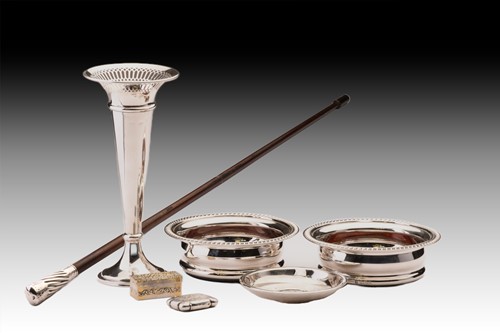 Lot 379 - A pair of silver wine coasters with gadrooned...