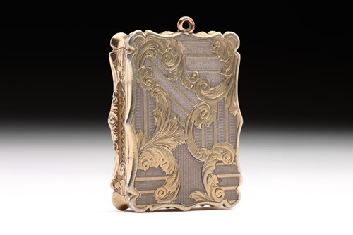 Lot 453 - A Victorian parcel-gilt vinaigrette; shaped...