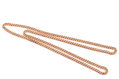 Lot 249 - A curb link endless chain in yellow gold,...