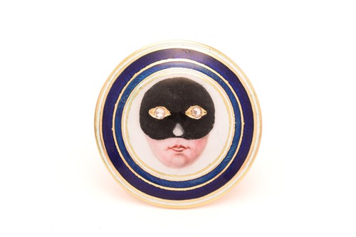 Lot 29 - An enamel masked lady ring, round disc...