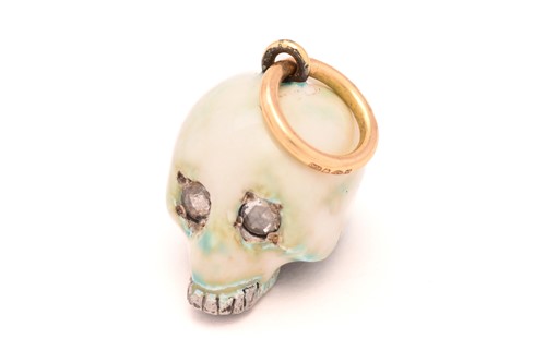 Lot 54 - An enamel skull charm pendant with diamonds, a...