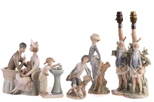 Lot 220 - Two Lladro figural table lamp bases, each...