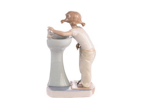 Lot 220 - Two Lladro figural table lamp bases, each...