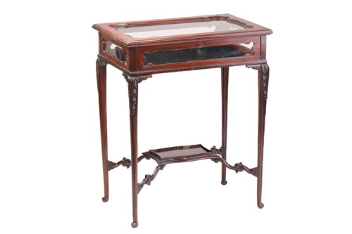 Lot 143 - An Edwardian mahogany "Chippendale" style...