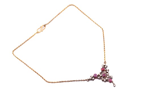Lot 24 - A diamond and ruby necklace, with four round...