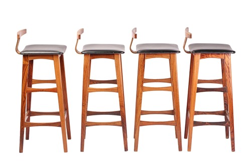 Lot 194 - A set of four late 1960s rosewood bar stools,...