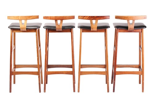 Lot 194 - A set of four late 1960s rosewood bar stools,...