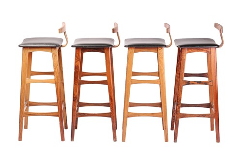 Lot 194 - A set of four late 1960s rosewood bar stools,...