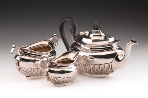 Lot 294 - An Edwardian three-piece silver tea set in...