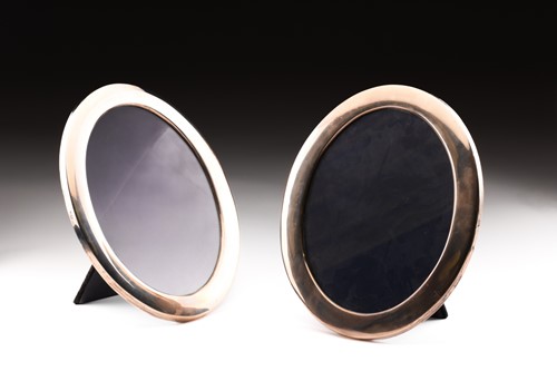 Lot 278 - A pair of Mappin & Webb oval photograph frames...