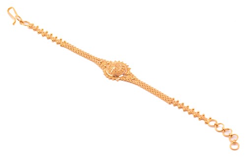 Lot 10 - A filigree bracelet; the central roundel, with...