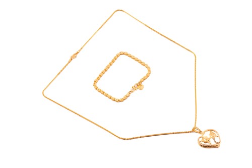 Lot 17 - A heart pendant on chain and a bracelet with...