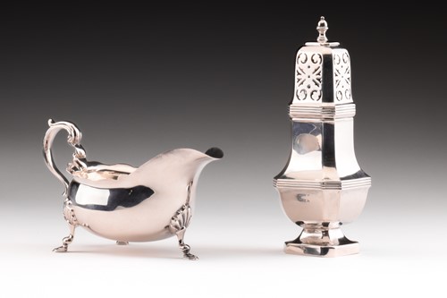 Lot 318 - An Edwardian silver sauce boat with undulating...