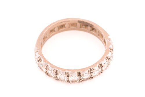 Lot 50 - A diamond half eternity ring, comprises ten...