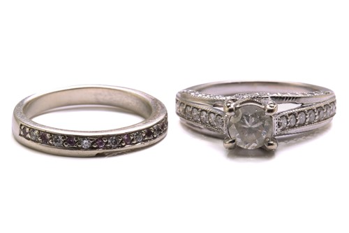 Lot 137 - A diamond trellis engagement ring and a fitted...
