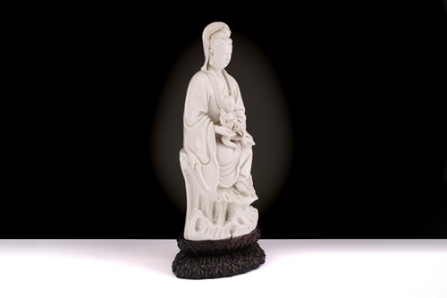 Lot 134 - A Chinese Dehua blanc de chine figure of...