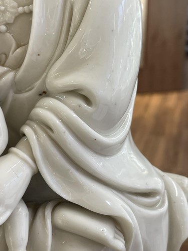 Lot 134 - A Chinese Dehua blanc de chine figure of...