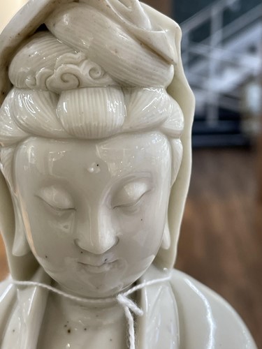 Lot 134 - A Chinese Dehua blanc de chine figure of...