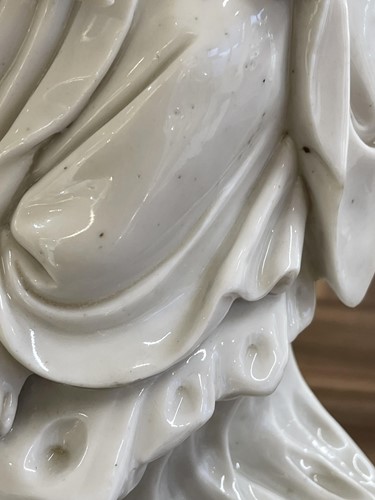 Lot 134 - A Chinese Dehua blanc de chine figure of...