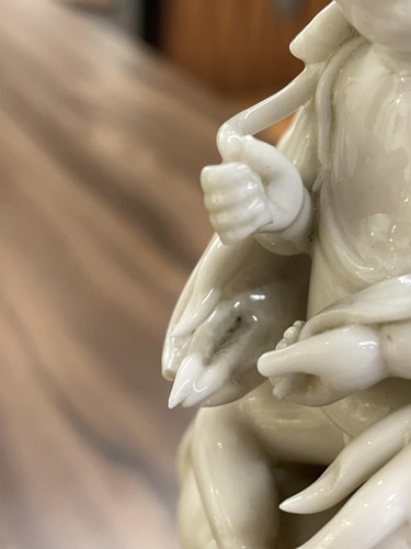 Lot 134 - A Chinese Dehua blanc de chine figure of...