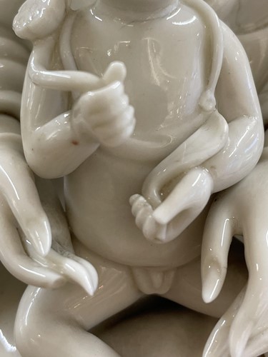 Lot 134 - A Chinese Dehua blanc de chine figure of...