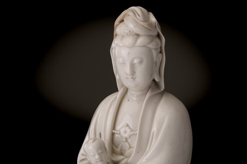 Lot 134 - A Chinese Dehua blanc de chine figure of...