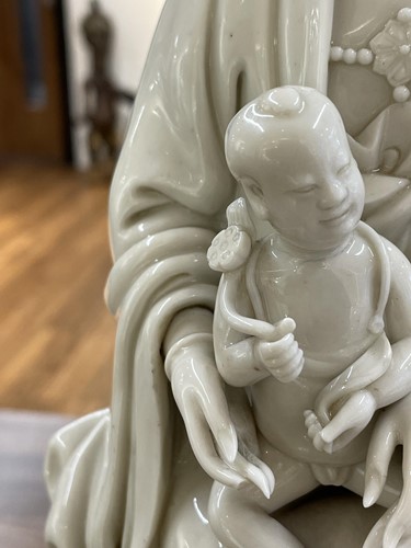 Lot 134 - A Chinese Dehua blanc de chine figure of...