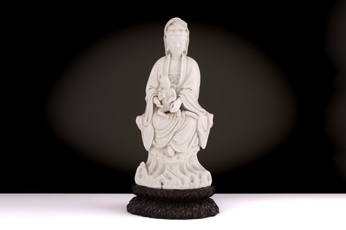 Lot 134 - A Chinese Dehua blanc de chine figure of...