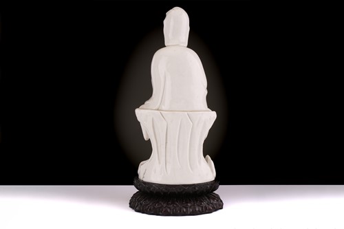 Lot 134 - A Chinese Dehua blanc de chine figure of...