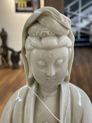 Lot 134 - A Chinese Dehua blanc de chine figure of...