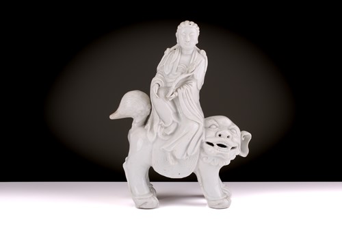 Lot 207 - A Chinese Dehua blanc de chine figure of...