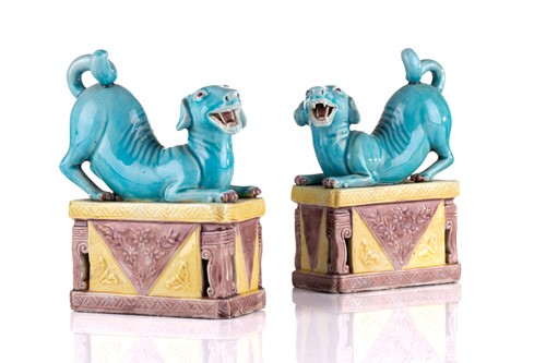 Lot 184 - A pair of Chinese torquoise glazed dogs, Qing...