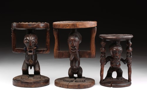 Lot 23 - Three Songye caryatid stools, Democratic...