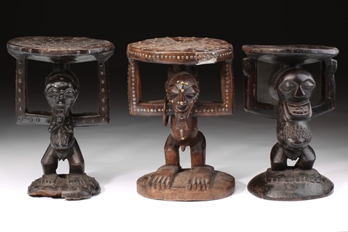 Lot 44 - Three Songye caryatid stools, Democratic...