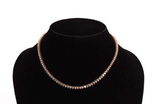 Lot 78 - A diamond rivière necklace, by Greek designer...