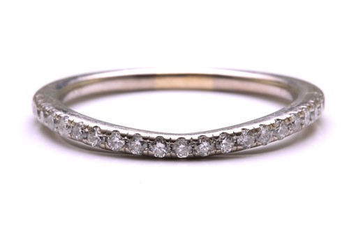 Lot 23 - A diamond-set half eternity ring, consisting...