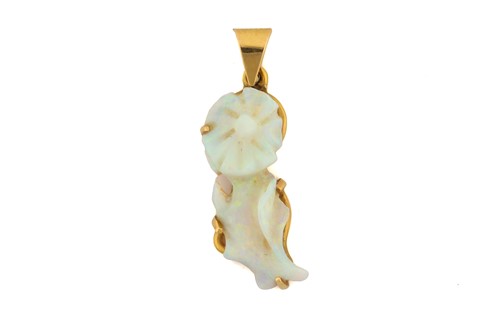 Lot 74 - A carved opal pendant, comprises precious opal...