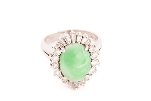 Lot 168 - A jade and diamond entourage ring, consisting...