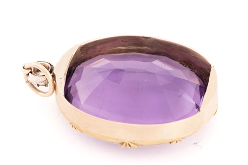 Lot 4 - A large amethyst and diamond pendant,...