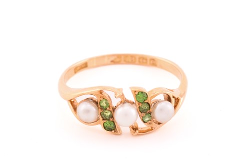 Lot 29 - A pearl and demantoid garnet dress ring in...